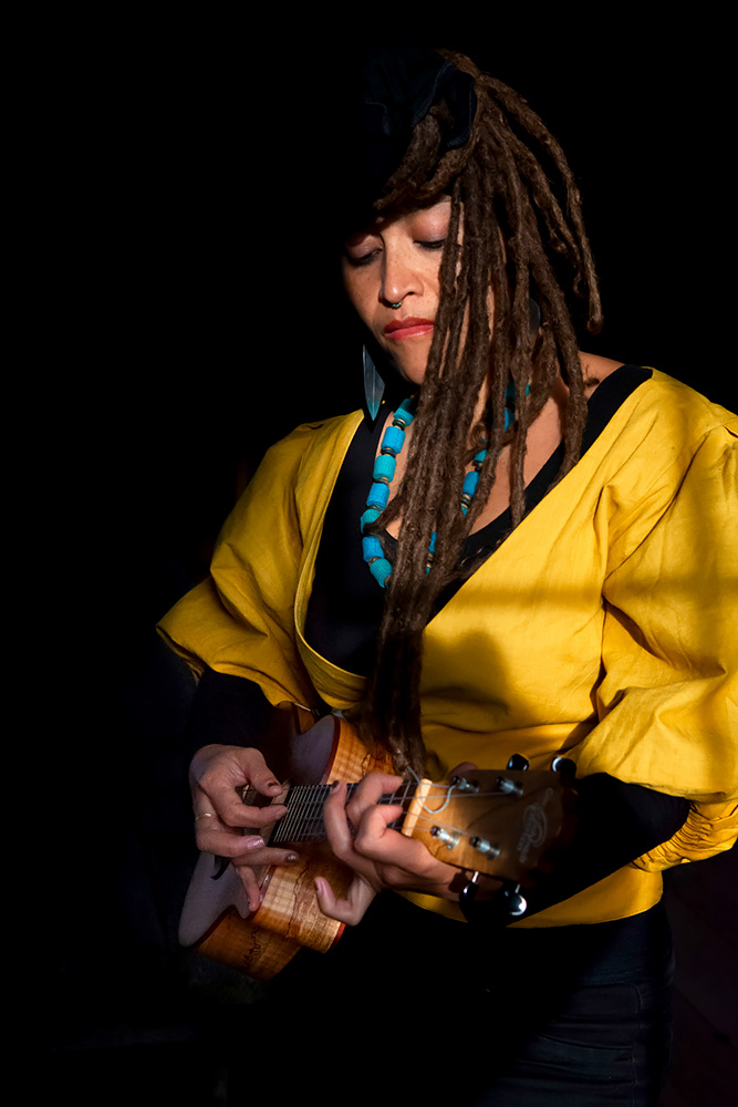 Portrait of artist Alixa Garcia playing the ukulele